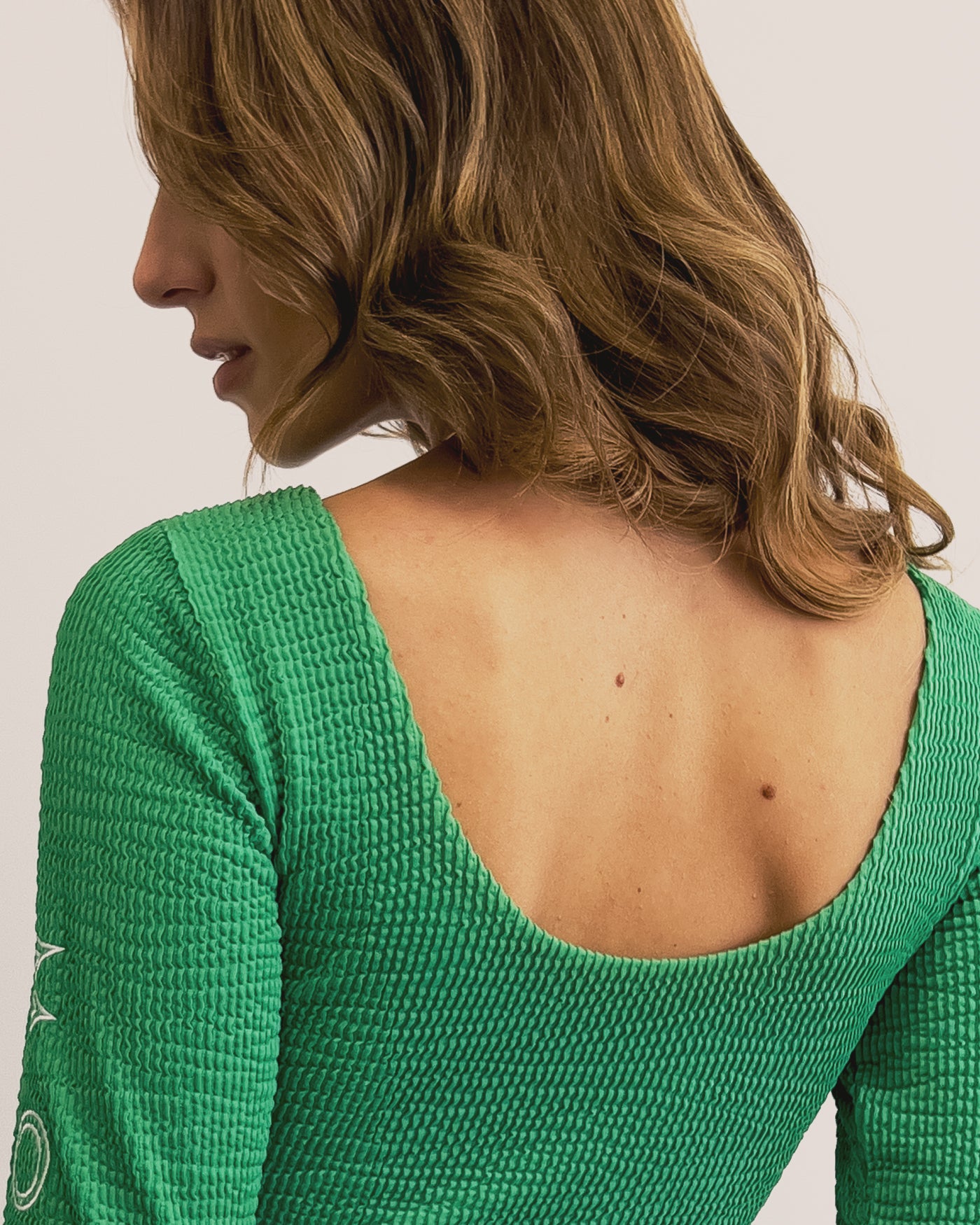 MONAT LONG SLEEVE GREEN BODYSUIT